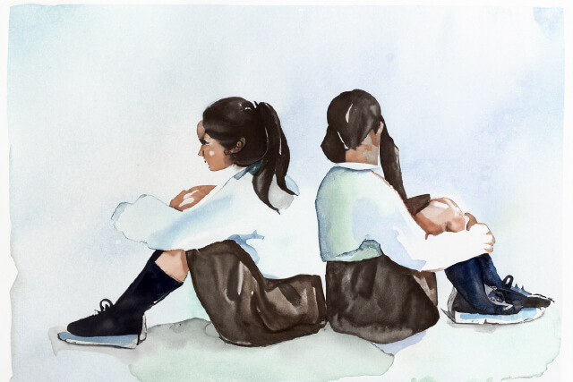 背中を向ける子供